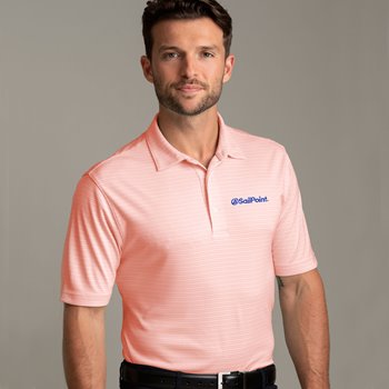 Tan male wearing salmon pink golf polo with navy blue logo embroidered