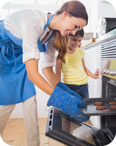 Mom and daughter baking cookies