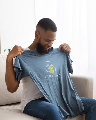 Man holding tshirt with 2-color imprint 
