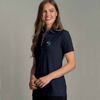 Tan, brunette woman wearing navy blue golf polo with embroidered logo 