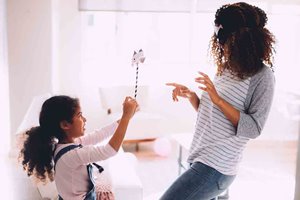 image of a mom and daughter playing in a house