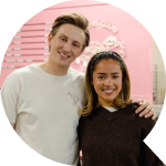 Speech bubble pointing right with a photo of the owners of Big Buns Club in the bubble
