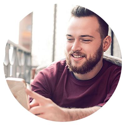 Smiling man, working on iPad