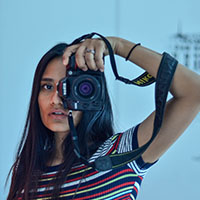 Girl taking a picture with camera
