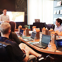 Person leading a meeting in a board room