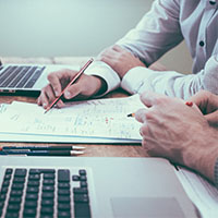 Two people working at a desk