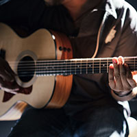 Person playing guitar