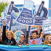 People Advocating and holding signs