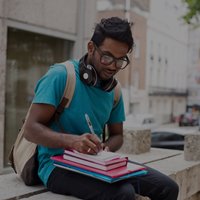 Student writing notes